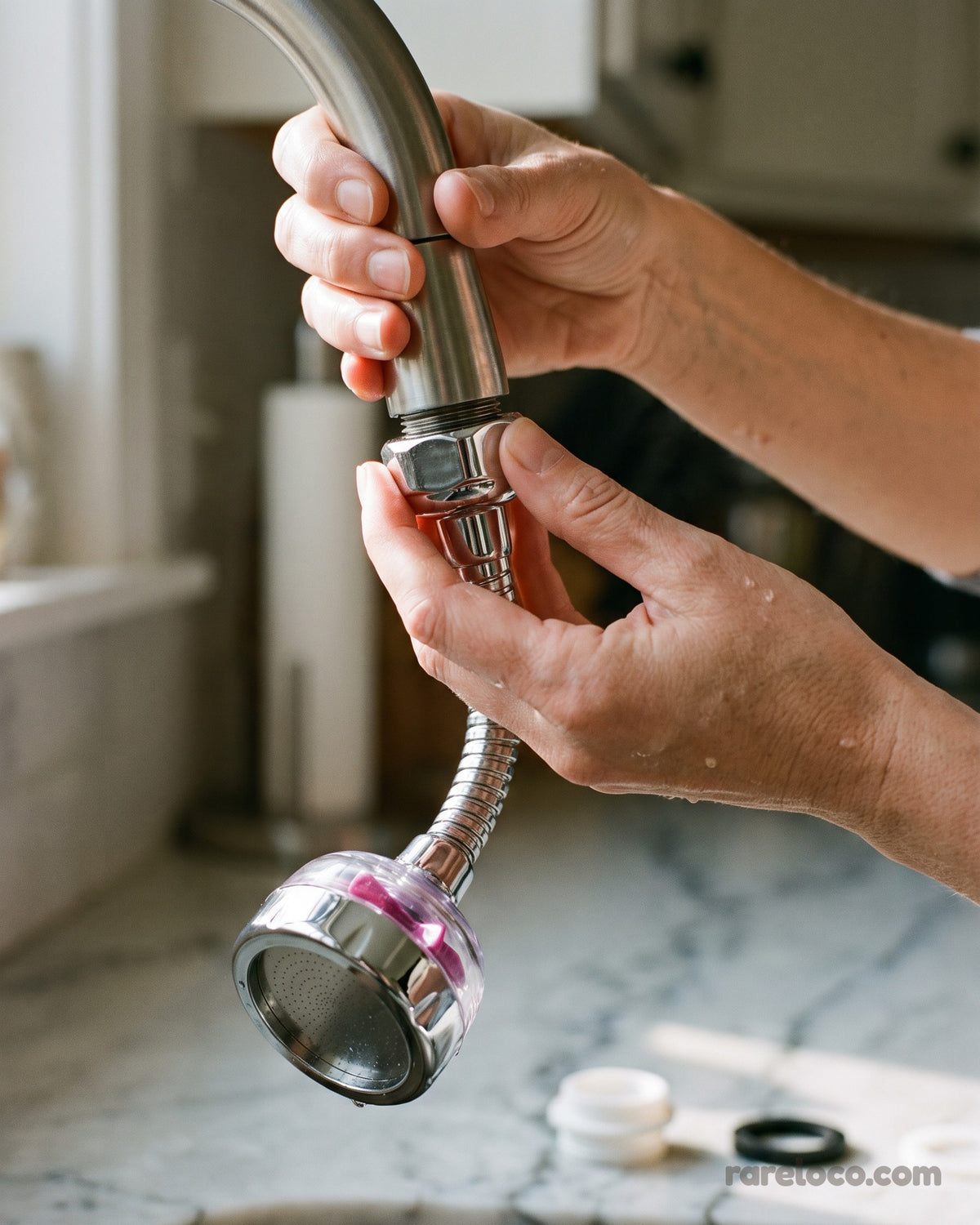 Screwing the extender onto the end of a tap by hand
