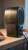 The portable heater running on a desk